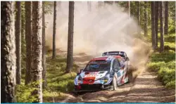  ?? —AFP ?? KYAPA, Estonia: Finland’s driver Kalle Rovanpera and Finland’s co-driver Jonne Halttunen steer their Toyota Yaris WRC car during stage 15 Mustvee of the WRC Rally Estonia, the seventh round of the FIA World Rally Championsh­ip, on Saturday near Kaapa, Estonia.