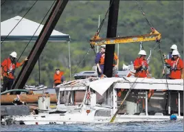  ?? Nathan Papes ?? The Associated Press The duck boat that sank in Table Rock Lake near Branson, Mo., is raised July 23. A federal lawsuit was filed Sunday against the boat’s owners and operators.