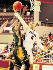  ?? Eddy Matchette / For the Chronicle ?? Atascocita’s Jerris Harris (4) drove by Sam Houston’s Kennard Robinson in the RCS Season Opener held at M.O. Campbell Center last week.