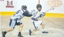  ?? BOB TYMCZYSZYN/POSTMEDIA NEWS ?? Carter Zavitz, shown on offence in this file photo, scored three goals to help the St. Catharines Athletics defeat the visiting Kitchener-Waterloo Braves 10-2 in junior A lacrosse Wednesday night.