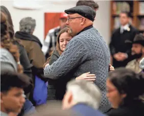  ?? ERIC GAY/AP ?? First Baptist Church Pastor Frank Pomeroy visits with family and victims before a vigil Wednesday in Floresvill­e, Texas.