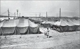  ??  ?? “THOSE TENTS were freezing,” recalls Julie Lam. Because she and her family were among the first at the camp, they arrived to a Quonset hut. “It had real doors.”