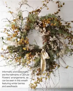  ??  ?? Informalit­y and seasonalit­y are the hallmarks of JamJar Flowers’ arrangemen­ts, as can be seen in this wreath featuring winter berries and seedheads