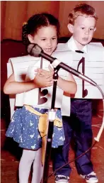  ??  ?? Meghan, 5 sings The Wheels On The Bus in 1986 at an end-of-year show at the private Little Red School House
(Pic Splash News)