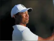  ?? RYAN KANG — THE ASSOCIATED PRESS ?? Tiger Woods watches his tee shot on the 16th hole during the second round of the Genesis Open golf tournament at Riviera Country Club on Friday in the Pacific Palisades area of Los Angeles.