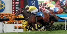  ??  ?? Werther wins the Hong Kong Gold Cup, with Hugh Bowman in the saddle.
