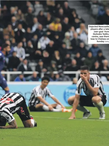  ?? Getty ?? Dejected Newcastle players after a late own-goal from DeAndre Yedlin, centre, saw them lose to Chelsea on Sunday