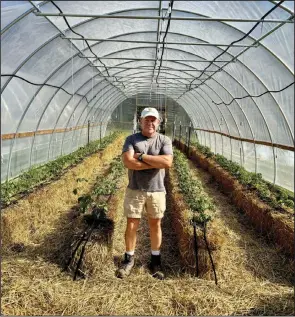  ?? (Special to the Democrat-Gazette/Janet Carson) ?? Kent Krause from Krause Farms will demonstrat­e how to grow tomatoes in hay bales at UAMS’ Earth Day celebratio­n.