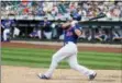  ?? FRANK FRANKLIN II — THE ASSOCIATED PRESS ?? New York Mets’ Devin Mesoraco follows through on a home run during the ninth inning of a baseball game against the Atlanta Braves, Sunday in New York.