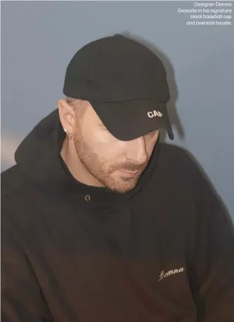  ?? ?? Designer Demna Gvasalia in his signature black baseball cap and oversize hoodie.