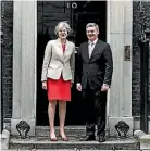  ?? TOBY MELVILLE/REUTERS ?? Bill English and Theresa May.