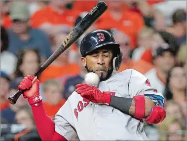  ?? DAVID J. PHILLIP/AP PHOTO ?? Eduardo Nunez of the Red Sox is hit by a pitch thrown by Charlie Morton of the Astros during the sixth inning of Sunday night’s game at Houston.