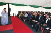  ?? ?? Tourism and Hospitalit­y patron First Lady Dr Auxillia Mnangagwa who is also academical­ly qualified in the sector, asks students questions to test their knowledge on traditiona­l dishes during the hand over ceremony of scholarshi­ps from United Nations Tourism at Zimbabwe House yesterday