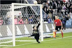  ?? REUTERS ?? Real Madrid goalkeeper Thibaut Courtois dives as Valencia’s Eray Comert fires over during the penalty shoot-out.