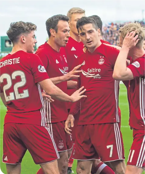  ??  ?? Aberdeen players celebrate Kenny McLean’s penalty against Rangers in May, but the Dons were pegged back to 1-1