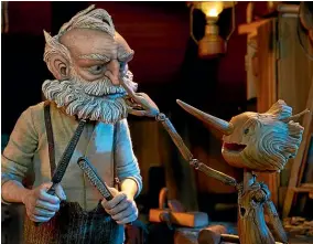  ?? ?? In del Toro’s adaptation of Pinocchio, Geppetto makes Pinocchio as a replacemen­t for the son he lost in the Great War.