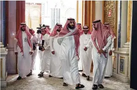  ?? New York Times file ?? Crown Prince Mohammed bin Salman, center, is consolidat­ing his power.