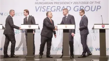  ?? — AFP ?? (L-R) Czech Prime Minister Andrej Babis, Austrian Chancellor Sebastian Kurz, Hungarian Prime Minister Viktor Orban, Slovakia’s Prime Minister Peter Pellegrini and Polish Prime Minister Mateusz Morawiecki shake hands during a press conference at a...