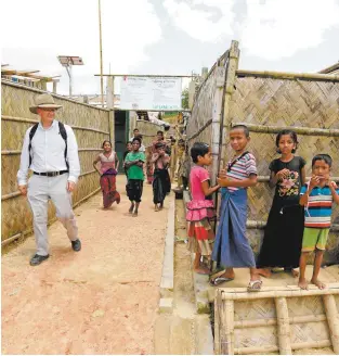  ??  ?? Labor MP Shayne Neumann visits a refugee camp near Cox’s Bazar in Bangladesh.