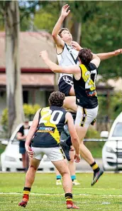  ?? ?? Yarragon’s Ryan Devin competes with Lang Lang’s Brett Kirkham in the ruck while Devine’s teammate Kalin Parker waits for the tap.