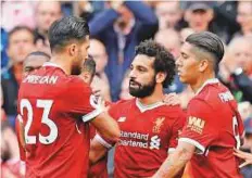  ?? Reuters ?? Liverpool’s Mohammad Salah celebrates with teammates after scoring a goal against Burnley in Anfield.