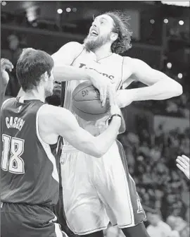  ?? Wally Skalij
Los Angeles Times ?? RYAN KELLY, who was scoreless in 21 minutes against Sacramento, has the ball stripped by the Kings’ Omri Casspi while driving at Staples Center.