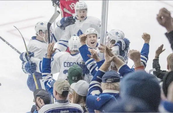  ?? THE CANADIAN PRESS/FILES ?? The Toronto Maple Leafs celebrate a goal against the Ottawa Senators during an NHL pre-season hockey game in Saskatoon on October 4, 2016.