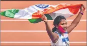  ??  ?? SWAPNA BARMAN is the first Indian to win an Asian Games gold in heptathlon -- a track and field contest made up of seven events. Barman, who has six toes in both her feet, battled severe tooth ache during the event and competed with a tape on her cheek.