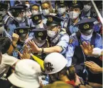  ?? Yuichi Yamazaki / Getty Images ?? AntiOlympi­cs protesters and police clash outside the Olympic Stadium.