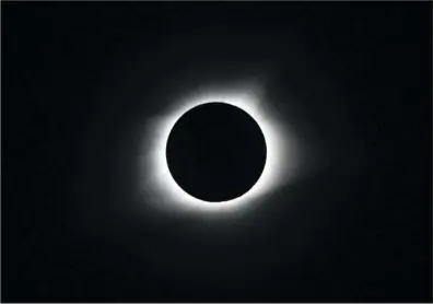  ?? The Sentinel-Record/Mara Kuhn ?? CELESTIAL: The moon completely covers the sun during a total solar eclipse Monday at the Homeplace, located at Land Between the Lakes National Recreation Area in northern Tennessee.