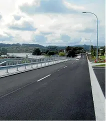  ??  ?? Opotoru Rd, right, and the new bridge with Rangitahi subdivisio­n behind it. Inset left, operations and sales manager Sam Laity.