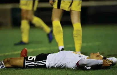  ??  ?? Ayr captain Steven Bell is left devastated at full time as the Honest Men pass up their chance to go top