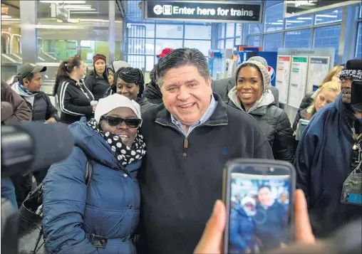  ?? ZBIGNIEW BZDAK/CHICAGO TRIBUNE ?? Gov.-elect J.B. Pritzker and Lt. Gov.-elect Juliana Stratton thank voters at the Roosevelt Street Orange and Green Line station in Chicago on Nov. 7.