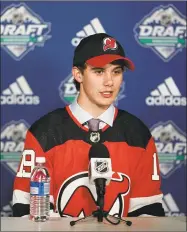  ?? Rich Lam / Getty Images ?? Jack Hughes speaks to the media after being selected first overall by the New Jersey Devils during the first round of the 2019 NHL Draft in June.