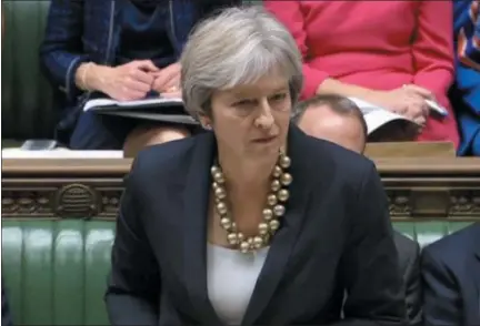  ?? PARLIAMENT TV VIA AP ?? In this image taken from Parliament TV, Britain’s Prime Minister Theresa May makes a statement to the House of Commons about the European Council summit, in London, Monday. May faces dissent from political opponents and from within her own ruling Conservati­ve Party over her blueprint for the Brexit separation and future relations with the EU.
