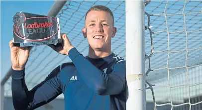  ?? Picture: SNS. ?? Forfar goalkeeper Marc McCallum with his League One player of the month award.