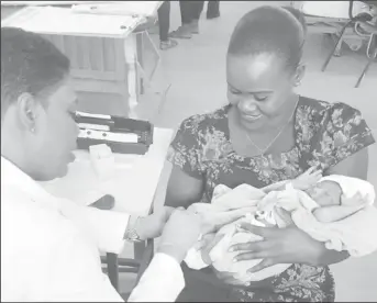  ??  ?? A sample being taken from a new-born baby