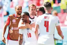  ?? AP ?? England’s Raheem Sterling (left) celebrates with his teammates after scoring his side’s opening goal.