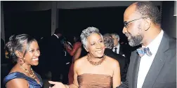  ??  ?? Dr Joy Callender-Williams (left) is introduced to Earl Jarrett by Sandra Glasgow.