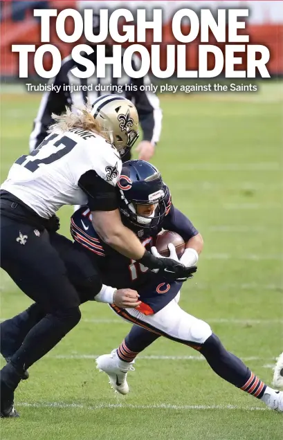  ?? GETTY IMAGES ?? Mitch Trubisky injured his right shoulder when he was tackled by linebacker Alex Anzalone running the ball on his lone snap in the first quarter of an overtime loss to the Saints on Sunday. The Bears aren’t sure how long he will be sidelined.