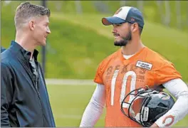  ?? BRIAN CASSELLA/CHICAGO TRIBUNE ?? Bears GM Ryan Pace and quarterbac­k Mitch Trubisky talk after practice last summer. Pace’s insistence on drafting Trubisky, at least so far, has been a disappoint­ment.