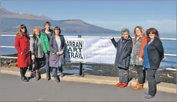  ?? 01_B13art01 ?? Avril Paton, third from the right, and Ann Hume officially open the new Arran Art Trail flanked by island artists and supporters.