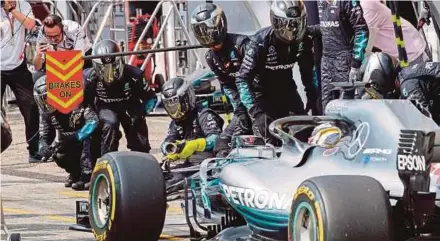  ?? AFP PIC ?? Lewis Hamilton of Mercedes AMG Petronas stops in the pits during the German Grand Prix on Sunday.