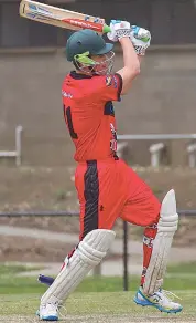  ??  ?? Jackson Clerks drives the ball down the ground late in Warragul’s innings.