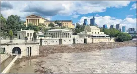  ?? COURTESY ELIZABETH ROWE VIA AP ?? This Aug. 4 photo shows the Philadelph­ia Art Museum, in the background, and high water levels of the Schuylkill River from the aftermath of Tropical Storm Isaias. The National Weather Service has confirmed that tornadoes touched down in Bucks and Montgomery counties during Tuesday’s storm.