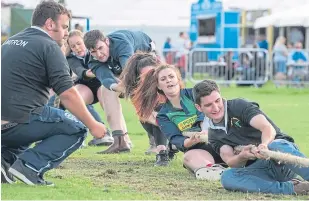  ??  ?? The Carse of Gowrie team dig their heels in during the tug o’ war contest.