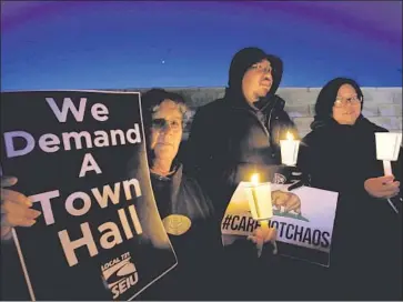  ?? Francine Orr Los Angeles Times ?? DORYCE CABALLERO, 59, left, of Lancaster, Dwyn Valdriz, 35, of Palmdale and Carole Lynn Valdriz, 35, of Palmdale protest against Rep. Steve Knight, a Republican who voted to repeal the Affordable Care Act.