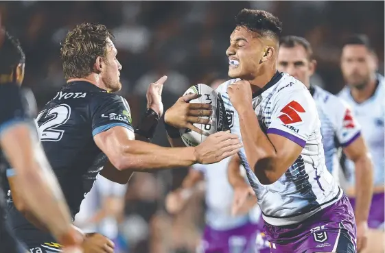  ?? Picture: GETTY IMAGES ?? Tino Fa'asuamaleau­i charges into the North Queensland defence in a trial match early this year.