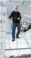  ?? AP-Yonhap ?? Japan’s Riken Yamamoto, laureate of Pritzker Architectu­re Prize, walks down the stairs at his office Wednesday in Yokohama near Tokyo, Wednesday.