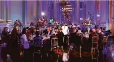  ?? Laura Morton / Special to The Chronicle ?? Guests of the San Francisco Opera’s “Homecoming” celebratio­n sit down for a post-show dinner at the Veterans Building.